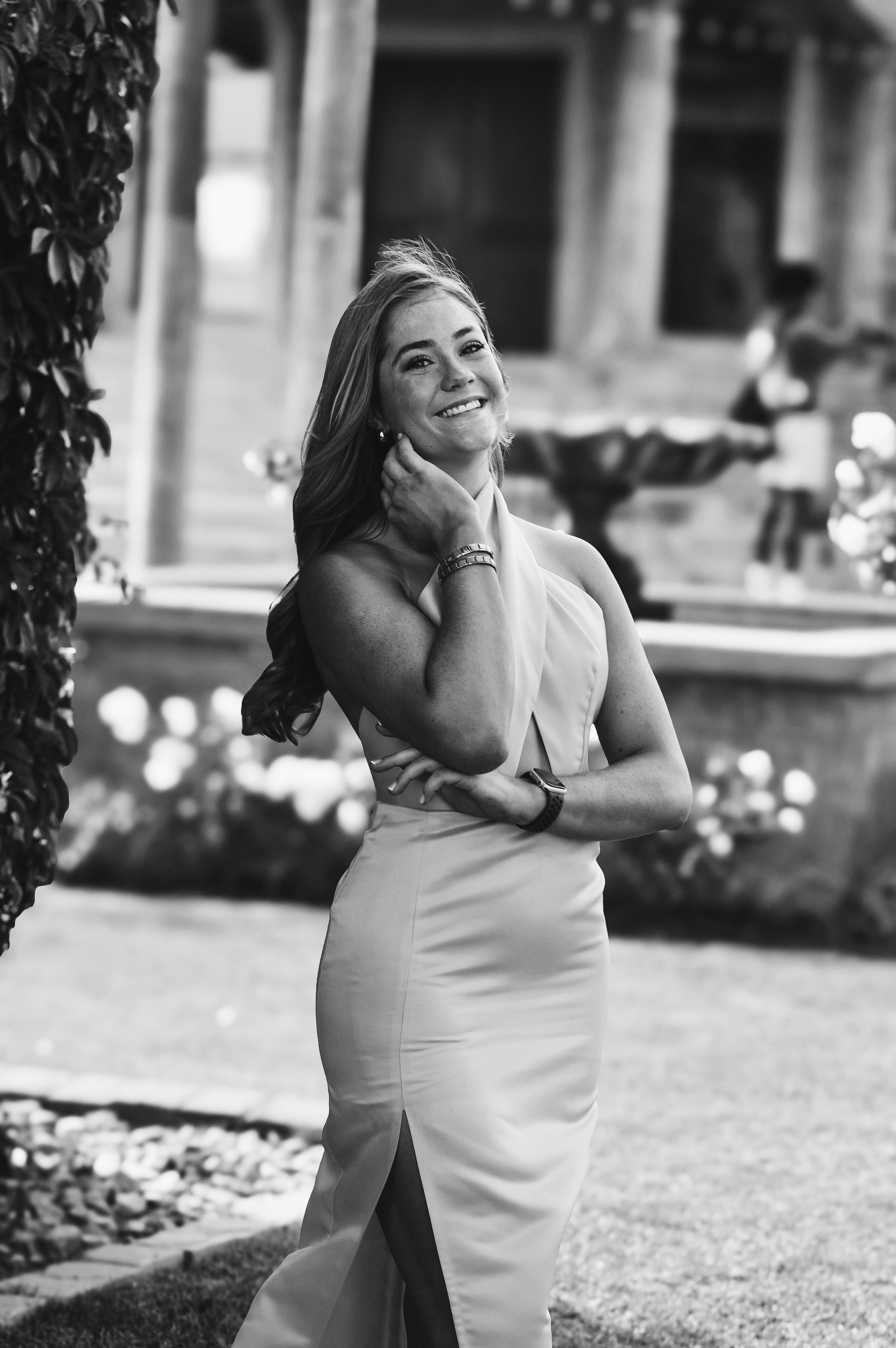 Woman wearing an evening dress at a formal garden venue